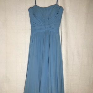 Baby blue below knee length dress.